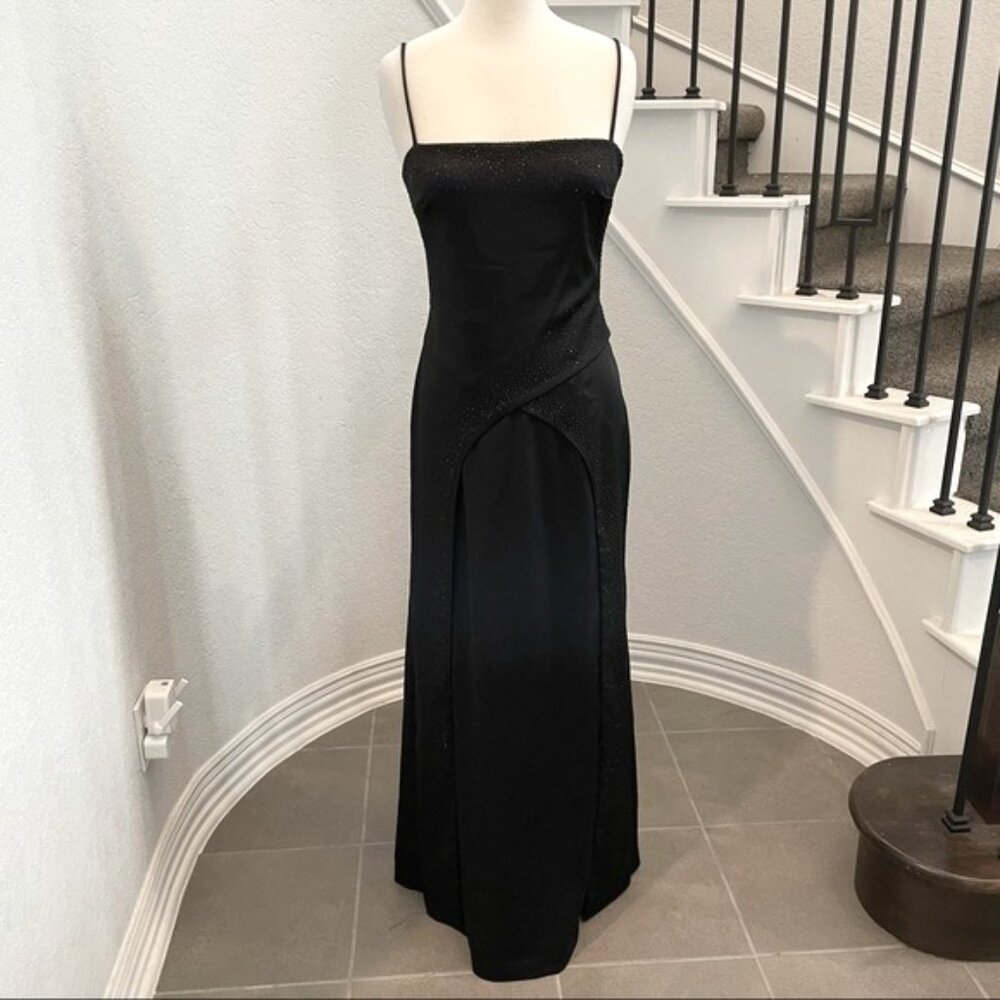Like new, black formal dress with crystals. Layered detail. Ties in the back. 11